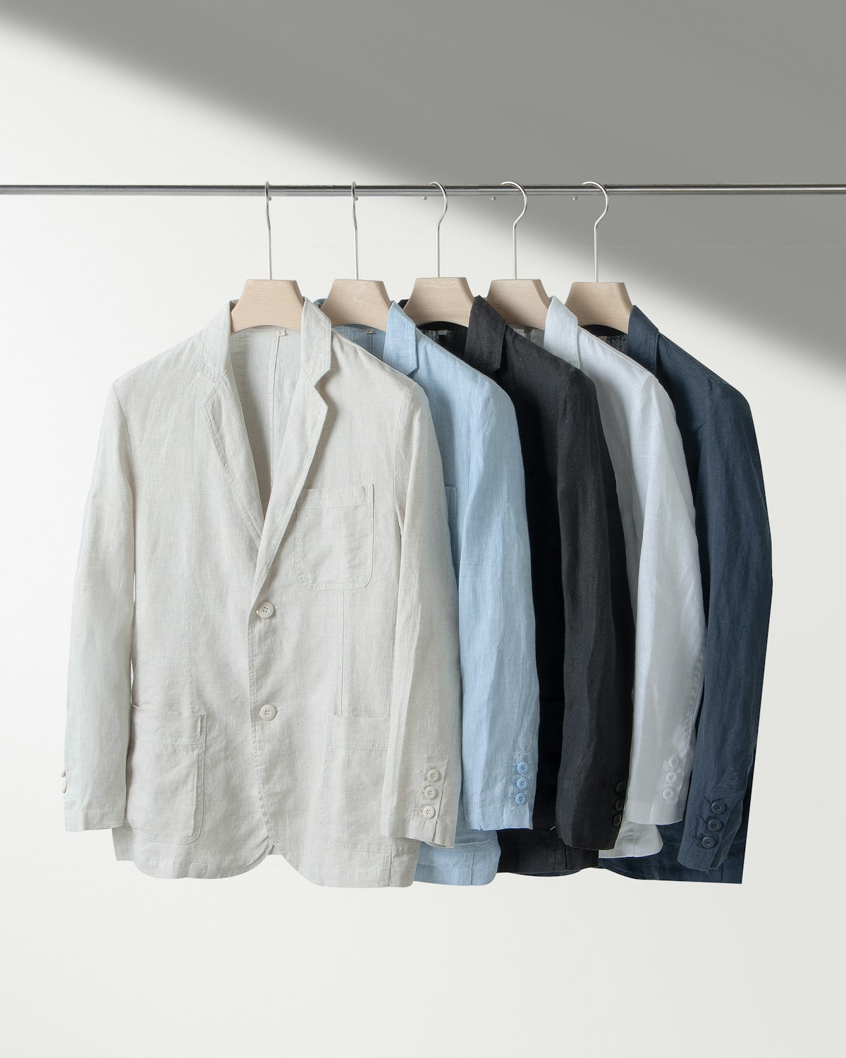 Sand linen blazer with notched lapels, unlined and single button