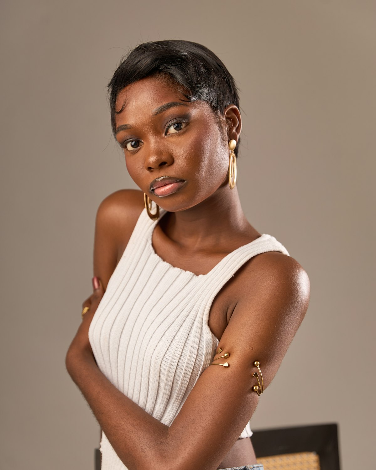 Ivory ribbed cotton tank with a scoop neck and narrow straps